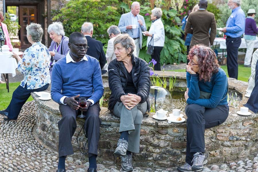 Amen Emmanuel , District Coordinator at Kulika Trust in Uganda speaking to Viv Horton (a trustee)