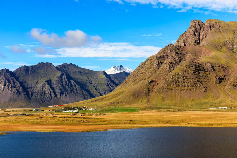 The village (west of Höfn) is dwarfed by the mountains behind