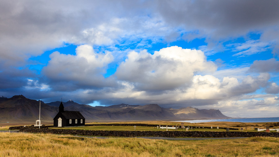 Budir church set in its environment of mountains and sea