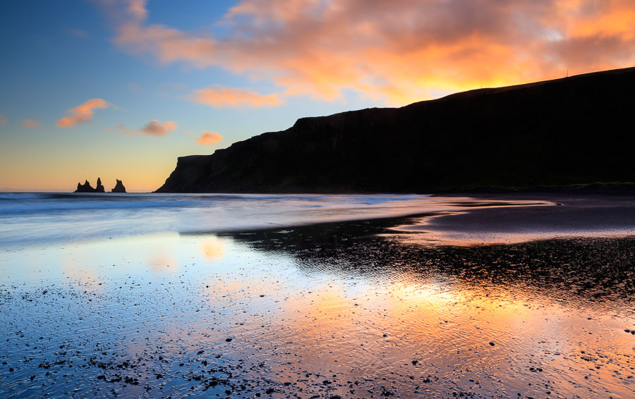 Sunset at Vik. Far back to the left are the stacks of hard to erode rocks that remains, when the loser parts have broken down into pebbles and sand.