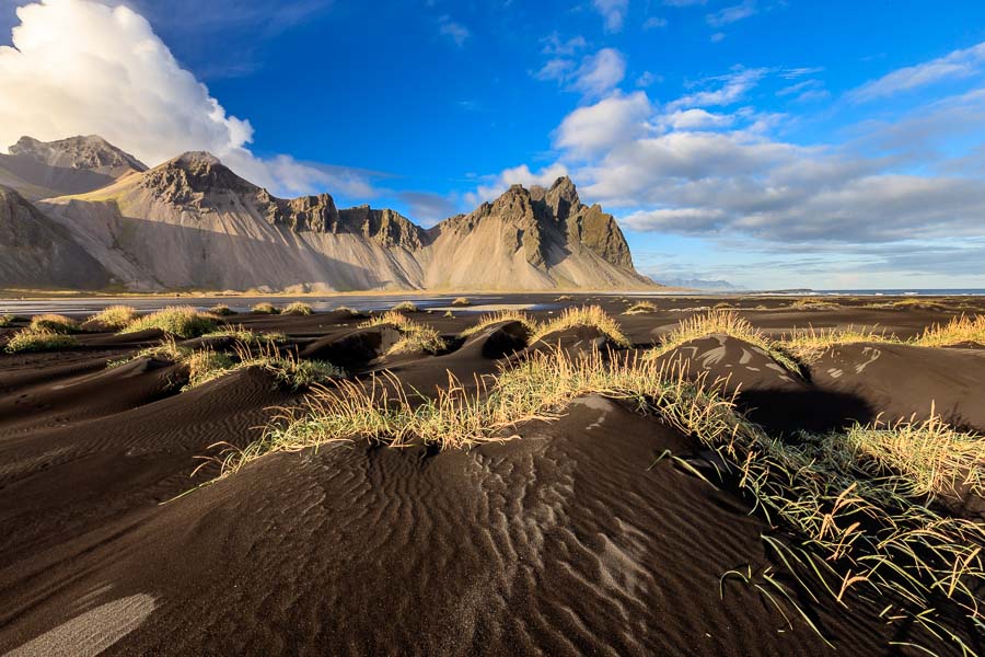 Stokksnes at evening sunlight. The sand is like most of Iceland of volcanic origin.