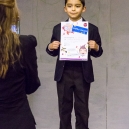 Eric receives a diploma for a mathematics award
