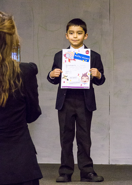 Eric receives a diploma for a mathematics award