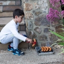 Eric was barbequeing his own sausages on his own BBQ.