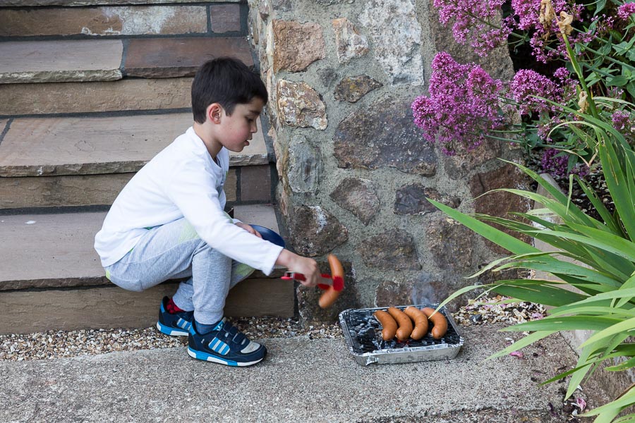 Eric was barbequeing his own sausages on his own BBQ.