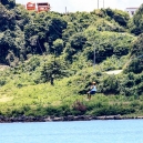 Mikee is ziplining in Pagudpud crossing the Blue Lagoon