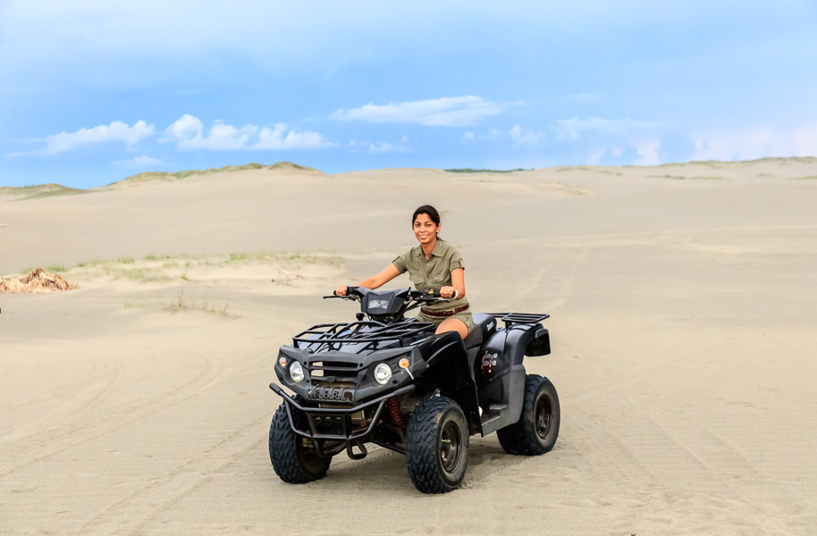 Jen driving a quad bike