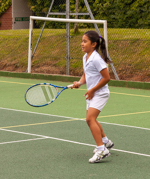 Mikee playing tennis on Speech Day