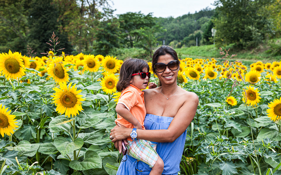 We biked and stopped in front of the flowers.