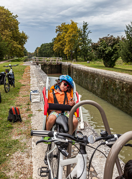 Eric had fallen asleep behind Mama on her bike