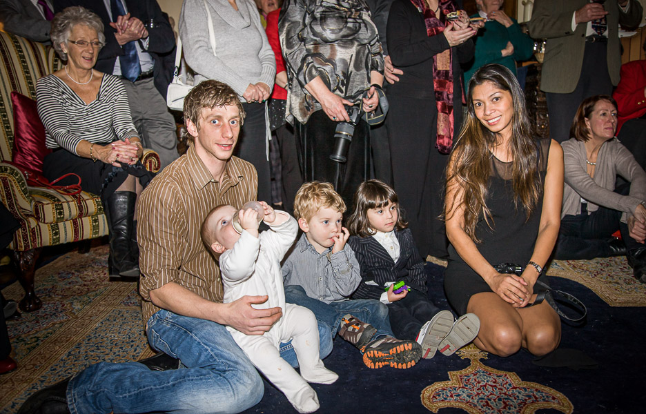 Lewis, Thalia, Caleb, Eric and Jennifer listening to the Carol singing