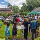 In the foreground people are queuing for the BBQ