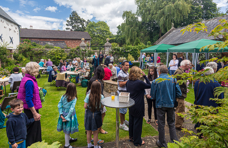 In the foreground people are queuing for the BBQ