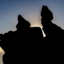 At sunrise from the other side, “Rugged Jack” is seen in silhouette.