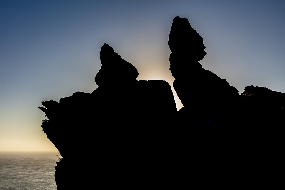 At sunrise from the other side, “Rugged Jack” is seen in silhouette.