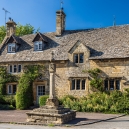 Stanton Village with the Village Cross in front of Rose Cottage