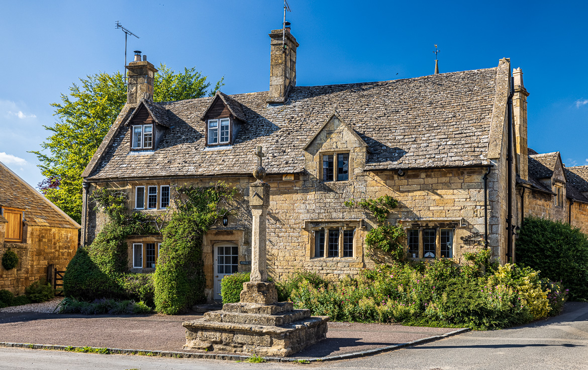 Stanton Village with the Village Cross in front of Rose Cottage