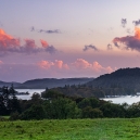 The last sunrays light up the clouds above Lake Windermere