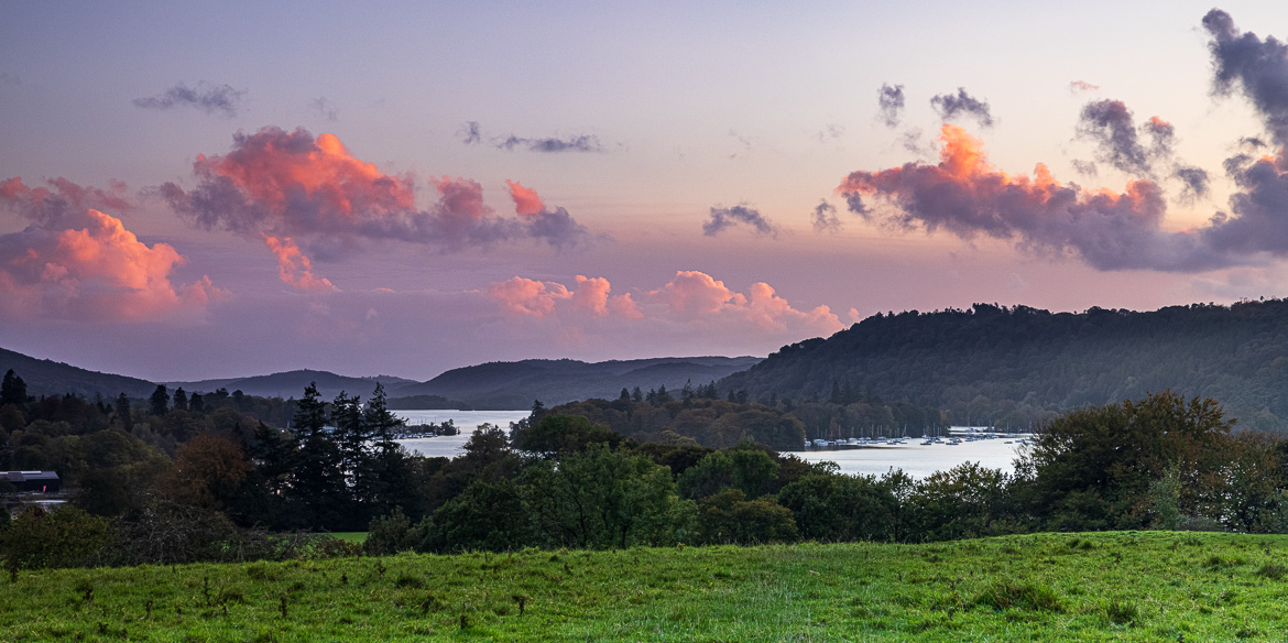 The last sunrays light up the clouds above Lake Windermere